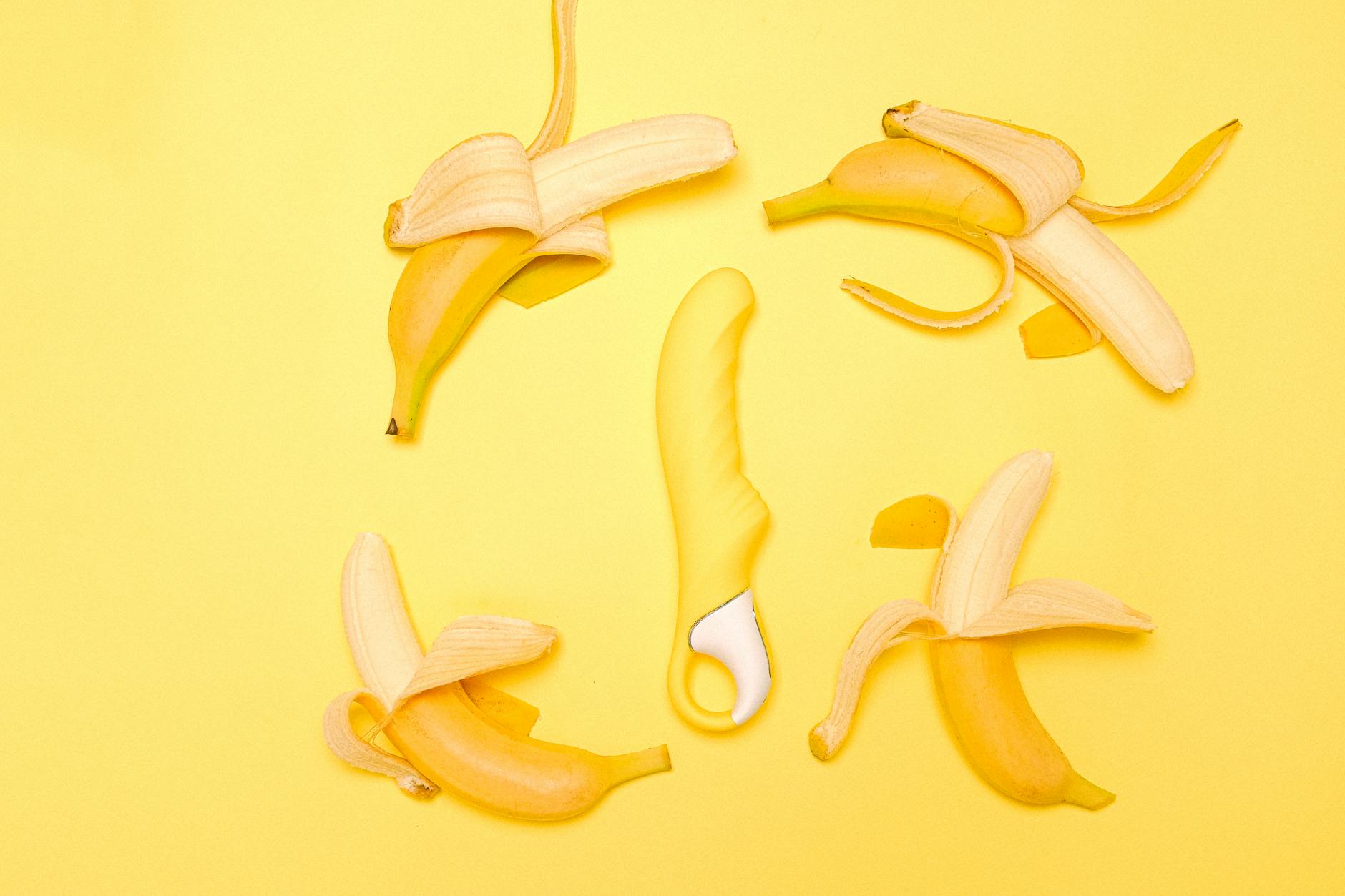 Yellow lemon vibrator displayed on a bright background representing shared pleasure and intimacy