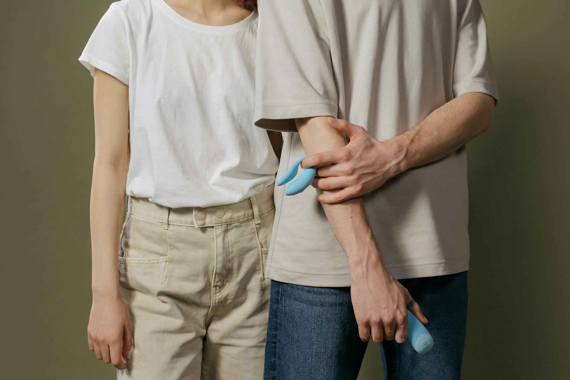 A couple exploring modern intimacy with a contemporary clitoral suction toy